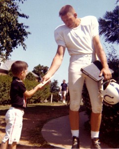 Johnny Unitas Signs Autograph 1964